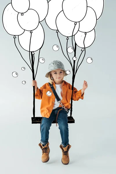 Carino bambino in jeans e camicia arancione seduto su altalena e guardando lontano su sfondo grigio con palloncini illustrazione — Foto stock