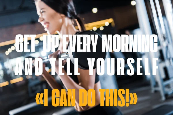 Selective focus of young woman working out with heavy barbell in gym with get up every morning and tell yourself you can do this illustration — Stock Photo