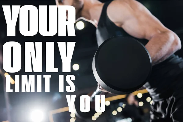 Selective focus of strong man exercising with heavy barbell in gym with your only limit is you illustration — Stock Photo