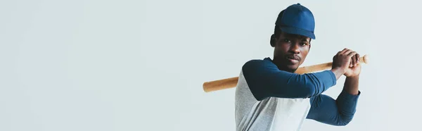 Panoramic shot of african american sportsman with baseball bat isolated on grey — Stock Photo