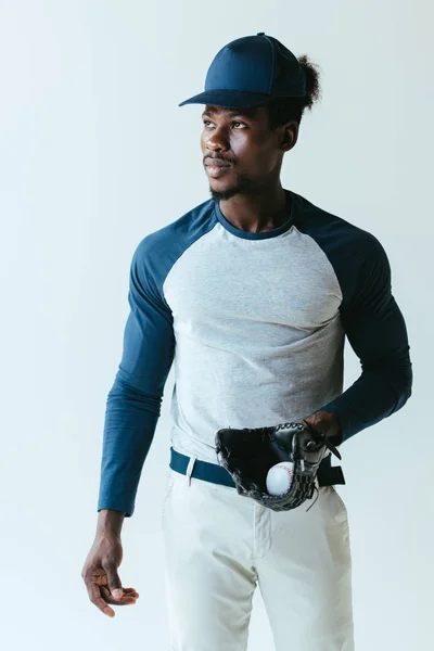 Confident african american baseball player looking away isolated on grey — Stock Photo