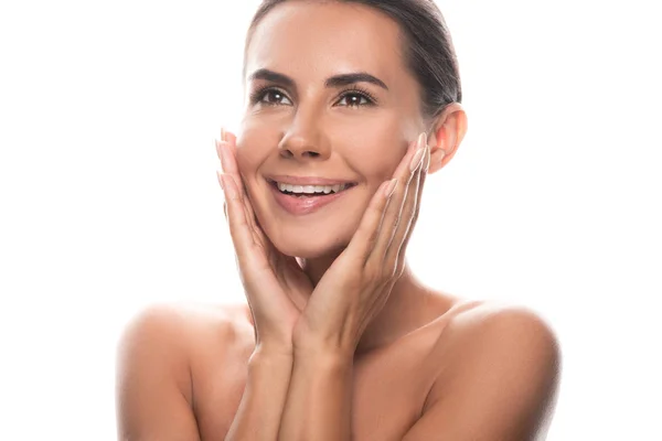 Excited naked young woman touching face with hands and laughing isolated on white — Stock Photo