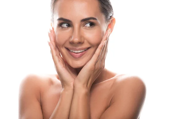 Excité nu jeune femme toucher le visage avec les mains et rire isolé sur blanc — Photo de stock