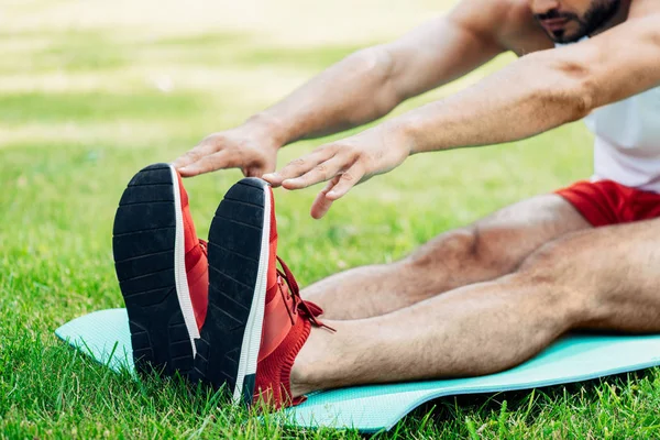 Cropped view of man doing stretching exercise — Stock Photo