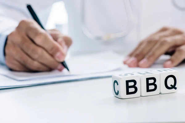 Selective focus of cubes with lettering BBQ on table — Stock Photo