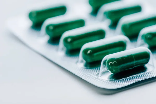 Selective focus of bright and colorful pills on white background — Stock Photo