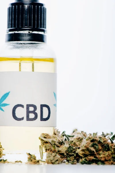 Cannabis oil in bottle with lettering cbd and medical cannabis on white background — Stock Photo