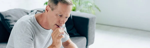 Panoramic shot of man smoking blunt with medical cannabis — Stock Photo