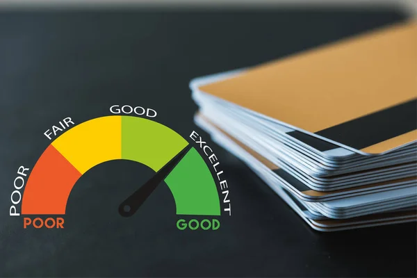 Selective focus of pile with credit cards near speed meter and lettering on black — Stock Photo