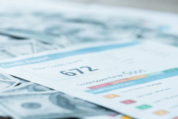 Selective focus of paper with credit score lettering on dollar banknotes — Stock Photo