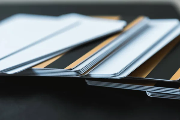 Selective focus of stack with credit cards on black — Stock Photo