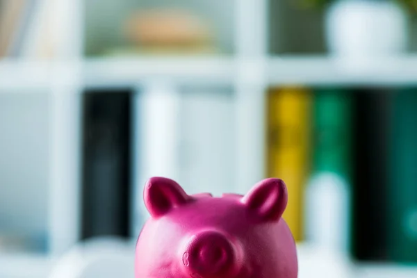 Toy and pink piggy bank in modern office — Stock Photo