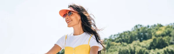 Panoramic shot of happy brunette woman in summer — Stock Photo