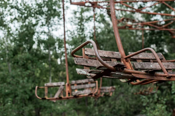 Selective focus of rusty red carousel in amusement park in chernobyl — Stock Photo