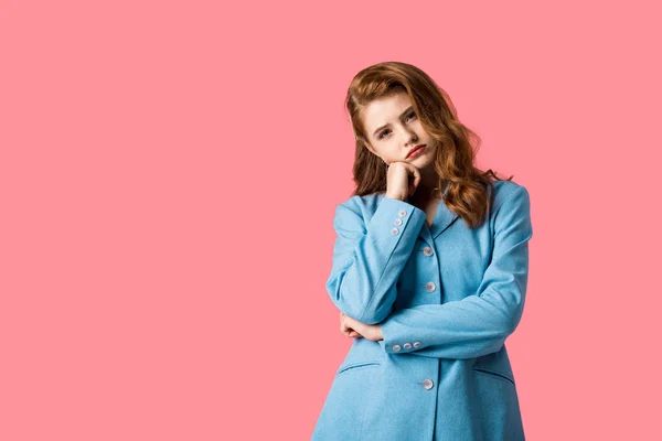 Sad redhead girl looking at camera isolated on pink — Stock Photo