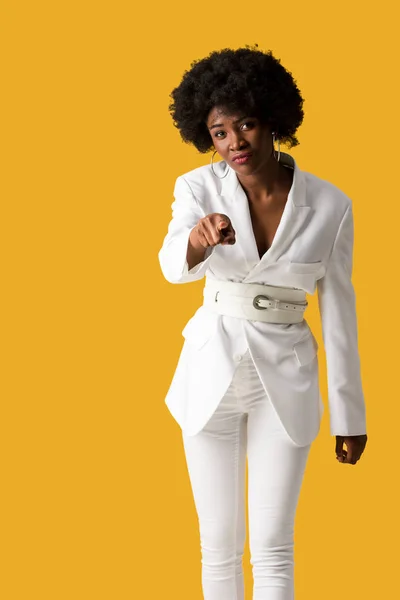 Selective focus of african american woman pointing with finger isolated on orange — Stock Photo