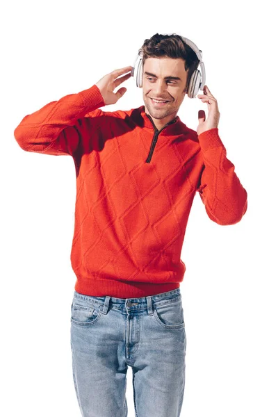 Schöner glücklicher Mann, der Musik mit Kopfhörern hört, isoliert auf weiß — Stockfoto
