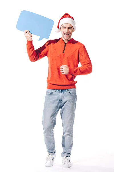 Homme souriant en santa chapeau tenant bulle de pensée vide bleu, isolé sur blanc — Photo de stock