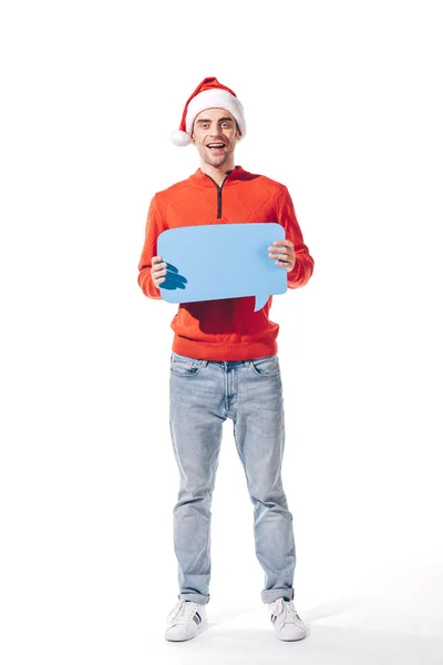 Щасливий чоловік у капелюсі Санта тримає блакитну порожню мислення бульбашку, ізольовано на білому — стокове фото