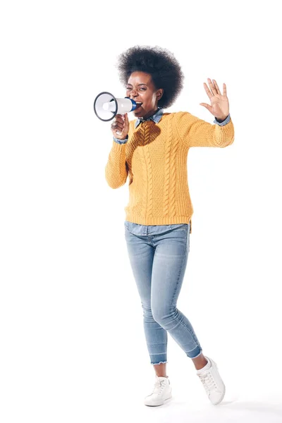 Attractive african american girl screaming into megaphone, isolated on white — Stock Photo