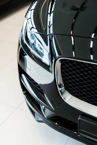 Black and shiny car in car showroom — Stock Photo