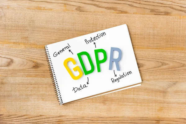 Top view of paper with gdpr lettering on wooden table — Stock Photo