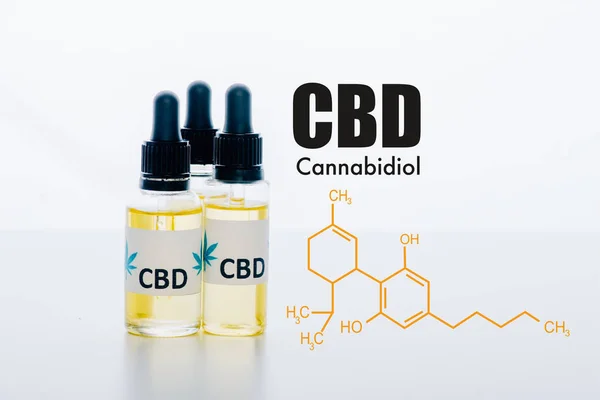 Cbd oil in bottles isolated on white with cbd molecule illustration — Stock Photo