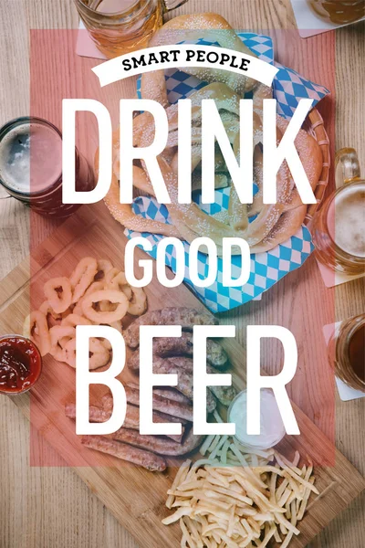 Top view of fried sausages, onion rings, french fries, pretzels and mugs with beer on wooden table in pub with smart people drink good beer illustration — Stock Photo