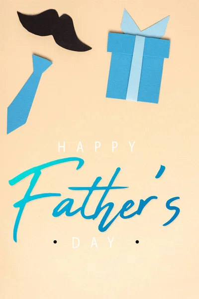 Top view of decorative paper crafted elements on beige background, happy fathers day illustration — Stock Photo