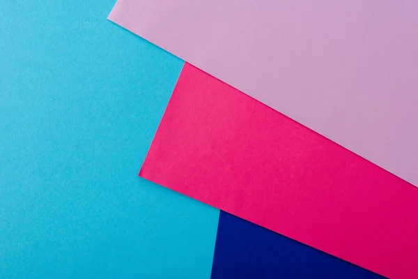 Abstract geometric background with pink, blue and violet paper — Stock Photo