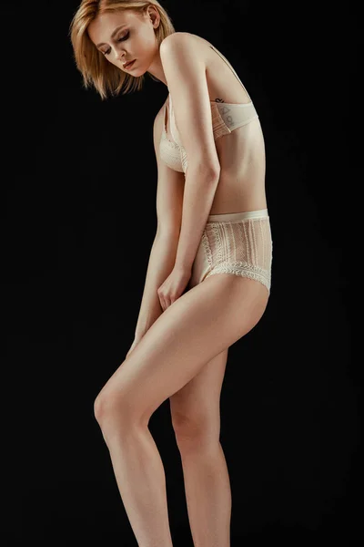 Sexy woman in lace underwear posing isolated on black — Stock Photo