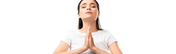 Panoramic shot of woman with closed eyes and praying hands isolated on white — Stock Photo