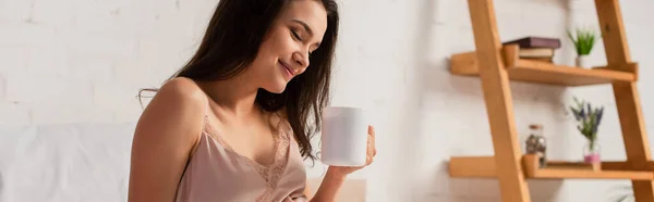 Panoramic concept of brunette woman holding cup of tea — Stock Photo