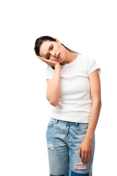 Exhausted woman in white t-shirt standing isolated on white — Stock Photo