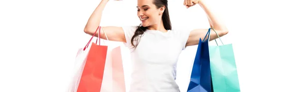 Panoramic crop of strong woman holding shopping bags isolated on white — Stock Photo