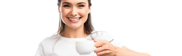 Panoramic shot of young brunette woman in white t-shirt holding cup with coffee isolated on white — Stock Photo