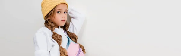 Side view of blonde girl in sportswear posing isolated on white, panoramic shot — Stock Photo