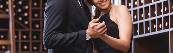 Website header of woman dancing with boyfriend in suit in restaurant — Stock Photo