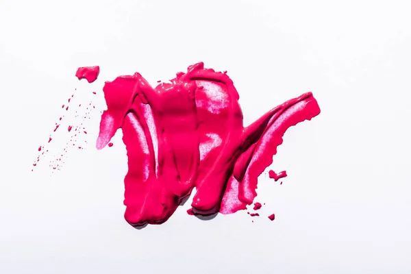 Top view of pink lipstick brushstrokes on white background — Stock Photo