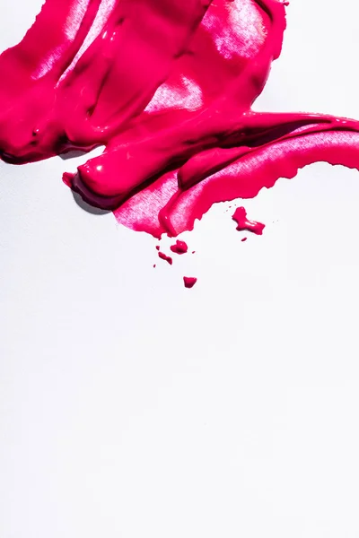 Top view of pink lipstick brushstrokes on white background — Stock Photo