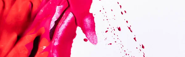 Top view of pink lipstick brushstrokes on white background, panoramic shot — Stock Photo