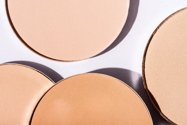 Close up view of face powder on white background — Stock Photo