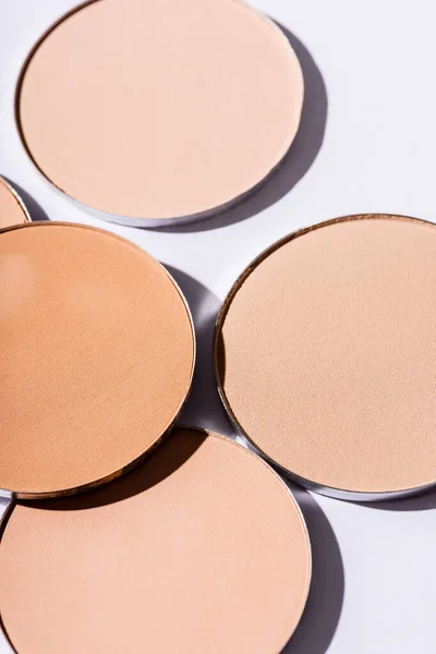 Close up view of face powder on white background — Stock Photo