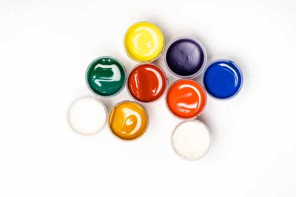 Top view of colorful Gouache paints on white background — Stock Photo