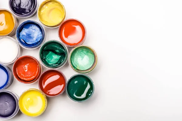 Top view of colorful Gouache paints on white background — Stock Photo