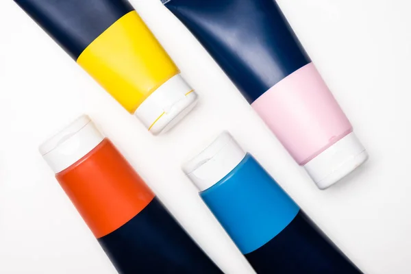 Top view of acrylic paint tubes on white background — Stock Photo