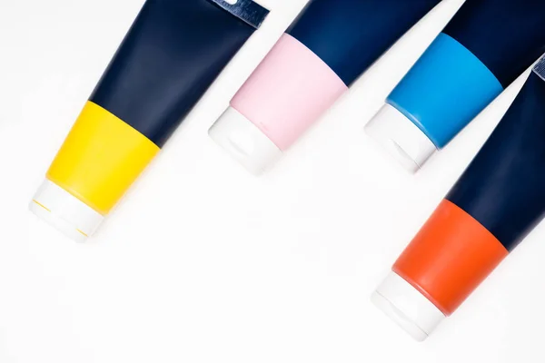 Top view of acrylic paint tubes on white background — Stock Photo