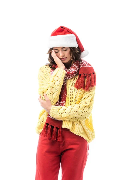 Upset woman with closed eyes, in santa hat and scarf standing isolated on white — Stock Photo