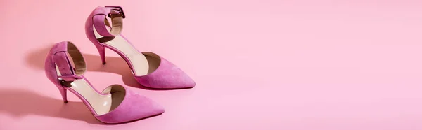 Pair of elegant suede heeled shoes on pink background, banner — Stock Photo