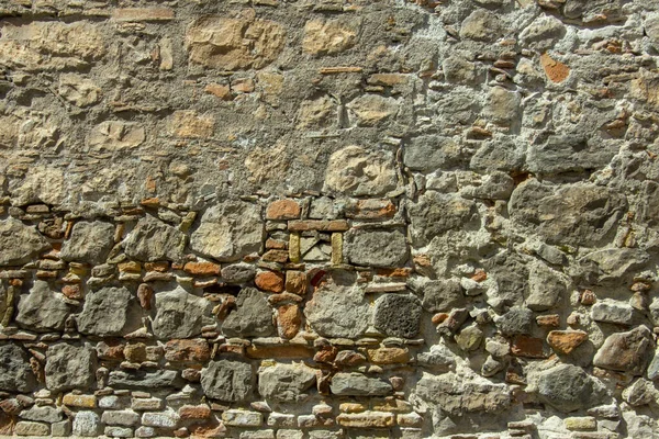 Грязная кирпичная каменная стена — стоковое фото